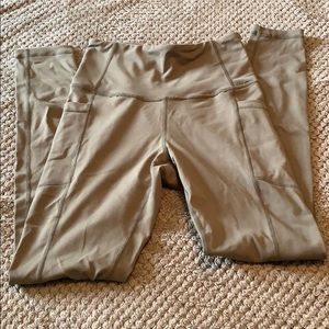 Olive green Ethos workout leggings with pockets.